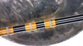 Selective removal of gold from metal tubing.  We have the capability to remove many types of metals and polymer coatings from flat and round surfaces.  Call or Email us today to discuss your application.