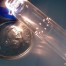 150 microns holes drilled around circumference of glass tube.