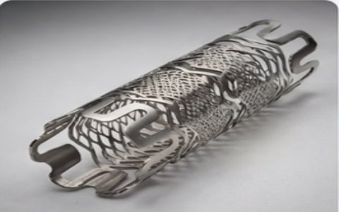 Gray metal tubular stent with an open lattice pattern, designed to hold a blood vessel open.
